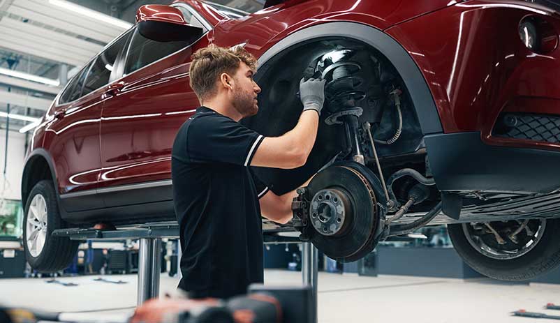 BMW Certified Technician servicing a BMW